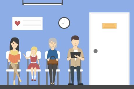 A waiting room at a podiatrists office with several people waiting.