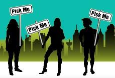3 people standing in front of a city scape holding signs saying "pick me"